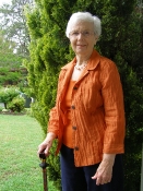 Joan wearing orange