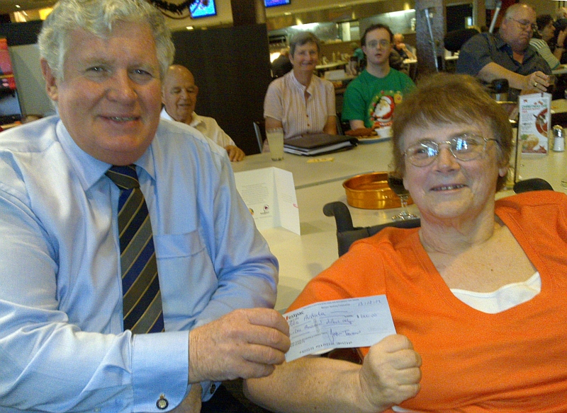 Dr John Tierney hands over the 1st State donation cheque to Gillian Thomas, Vice President of Polio Australia