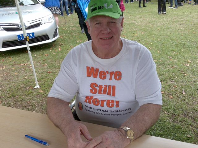 Polio Australia's President, John Tierney, at the registration table