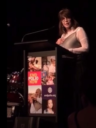 Sue Mackenzie addressing Rotary Club of Burleigh Heads _End Polio Now_ Dinner